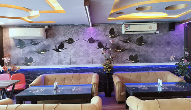 Cozy dining space at Ten11 Restaurant in Saguna More, Patna